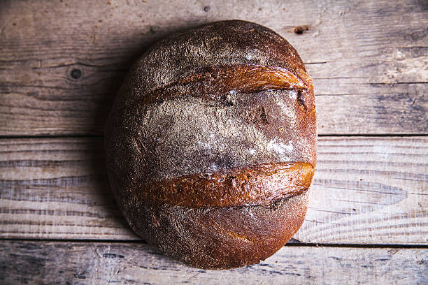 istock fresh bread  and wheat on the wooden 477612866