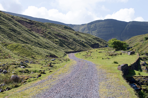 Landscape image of a curving footpath on Llyn Y Fan Fach mountain range