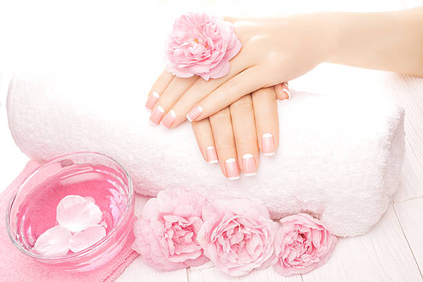 istock french manicure with rose flowers. spa 477613040