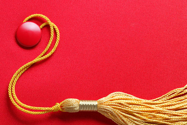 istock Red Graduation Cap With Gold Tassel 477613192