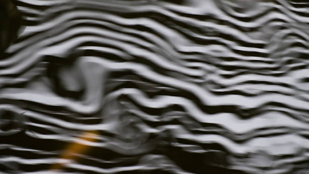 istock abstract of water wave and fish in pond 477613610