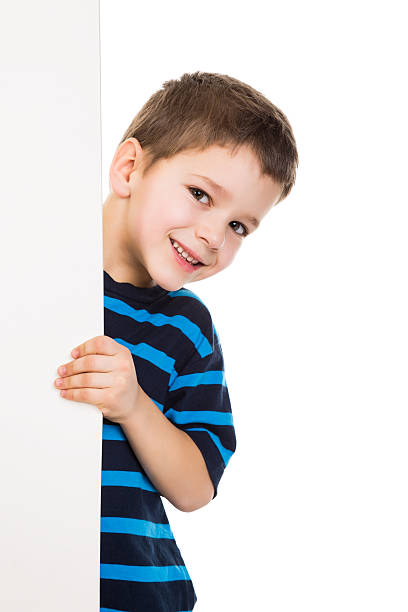 Boy peek out from vertical white banner