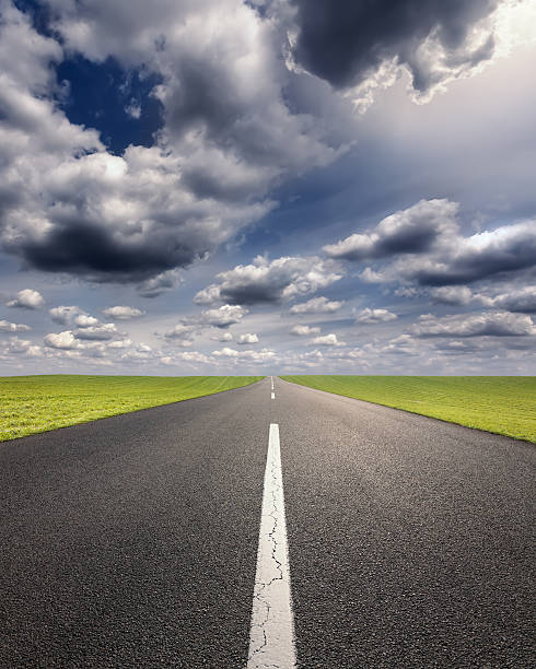 istock Driving on an empty asphalt road at idyllic sunny day 477614218