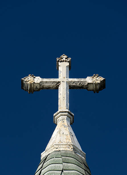 istock Ornate Deteriorated White Church Cross 477614490