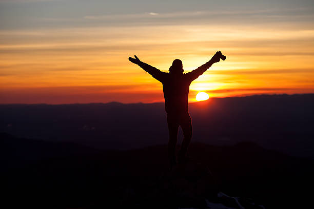 istock silhouette of photographer in sunset 477614659