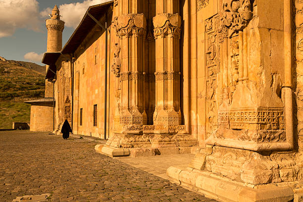 divrigi ulu camii Turkey, Sivas, Divrigi, Ulu Cami, Grand MosqueGreat Mosque. View of the secondary entrance to the Grand Mosque Great Mosque, Ulu Cami, facade of the hospital. The Seljukian Hospital of Divrigi stands out on account of the extraordinary peculiarity of its architectural decorations and monumental portal, which recall the characters of the Gothic architecture introduced by the Crusaders. Ogival arches pointed arches geometric star pattern decorations. The architectural structure with the minaret, left, is the Ulu Cami. camii stock pictures, royalty-free photos & images