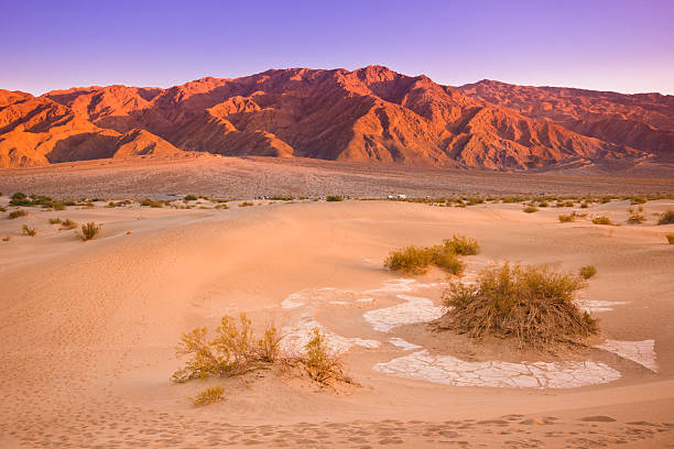 Death Valley California Colorful sunset over Mesquite dunes of Death Valley California death valley desert photos stock pictures, royalty-free photos & images