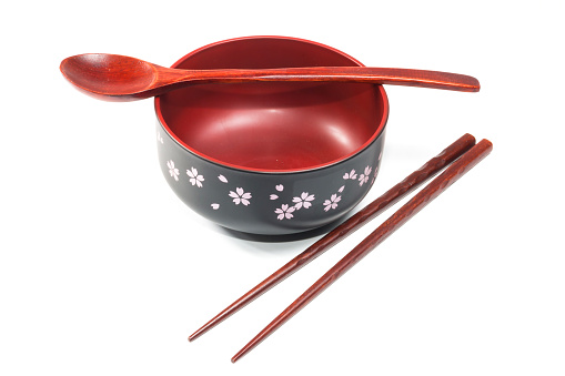 Traditional tableware of Japan, chopsticks and bowl isolate on white