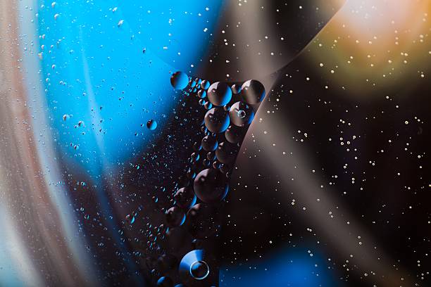 istock Abstract background of oil droplets on water surface 477624578