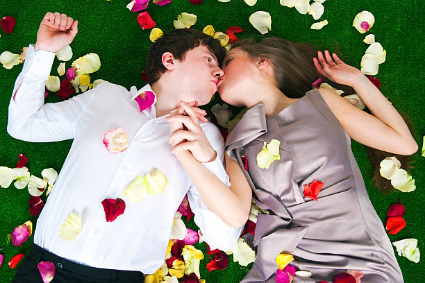 beliebte - human hair women horizontal rose petals stock-fotos und bilder