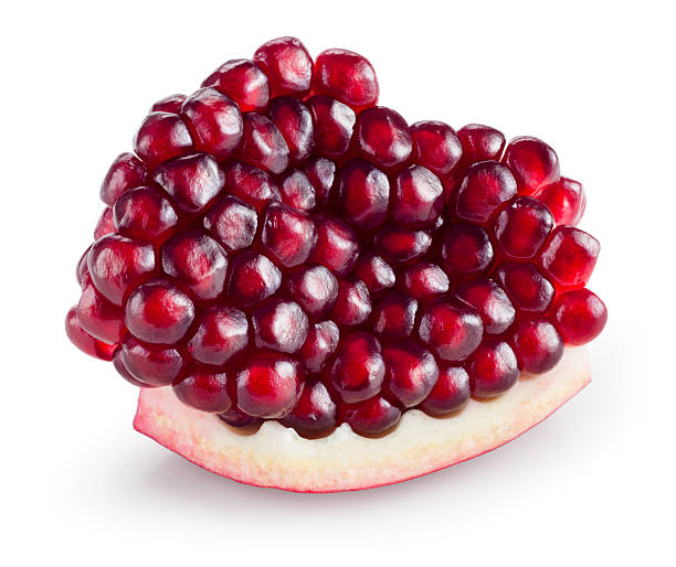 istock Pomegranate. Piece isolated on white background. With clipping path. 477627922