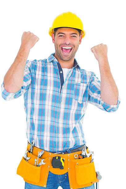 istock Excited manual worker clenching fists 477628132