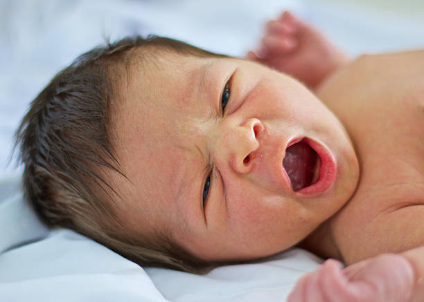 istock Baby Boy with Eyes and Mouth Open 477630338