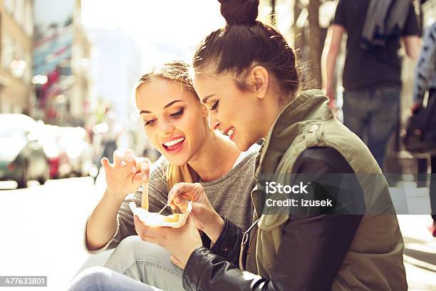 Young Women In The City Stock Photo - Download Image Now - Eating, Friendship, Snack
