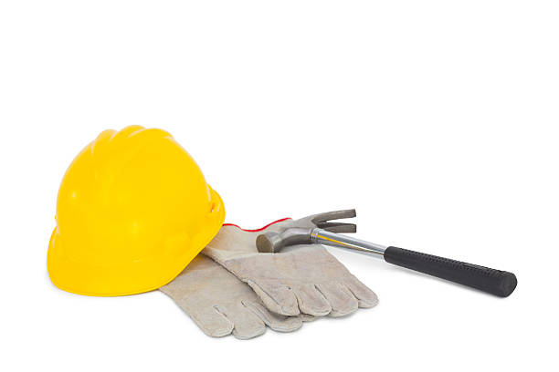istock Gloves with hammer and hardhat on white background 477634476