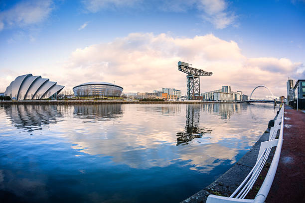 The River Clyde, Glasgow Landmarks on the River Clyde in Glasgow looking towards the Clyde Arc bridge. glasgow scotland stock pictures, royalty-free photos & images
