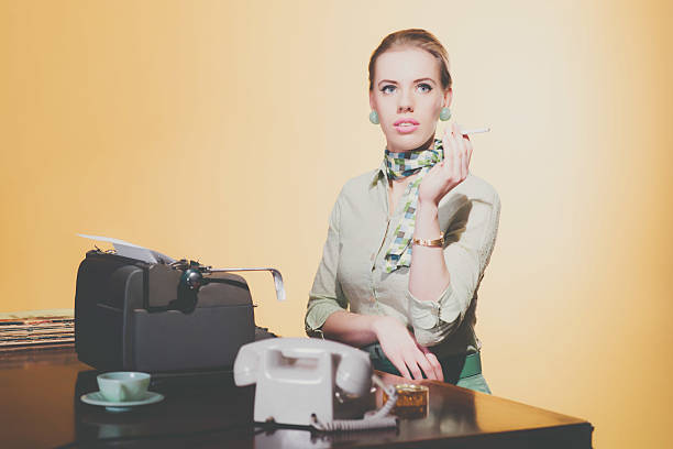 istock Cigarette smoking vintage 50s young blonde secretary having coffee break. 477636872