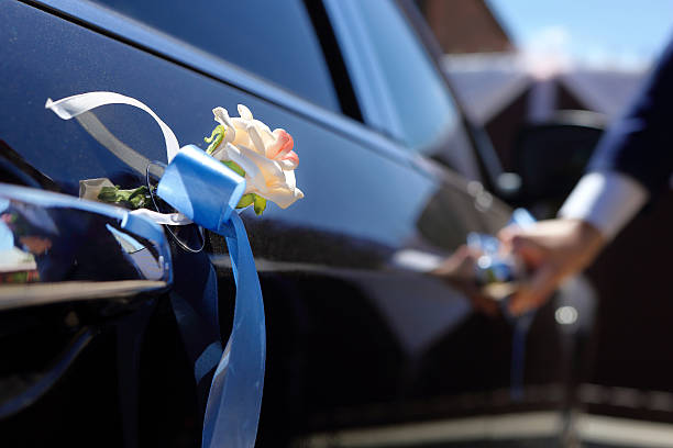 istock Groom gets into the car 477637024