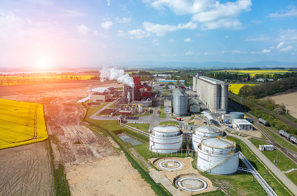 istock Sunset over biofuel factory 477637524