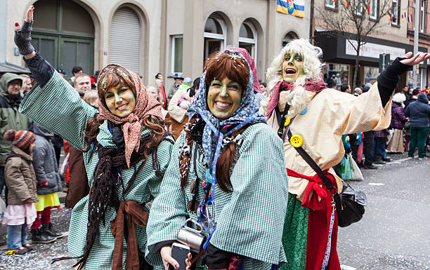 Cologne, Germany - March 03, 2014: unidentified people, costumed as the Hatter from Alice in Wonderland, along the Rose Monday parade in Cologne