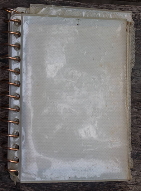 istock Vintage book, open, on old wooden table, with clipping path 477640595