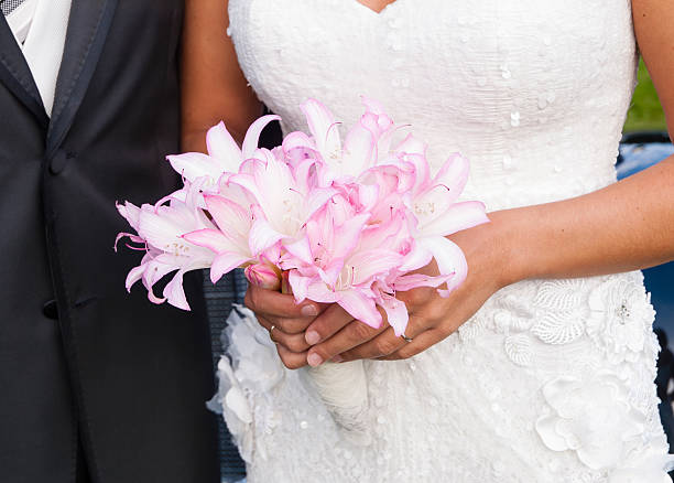 istock Bride holding a bouquet of flowers 477641347