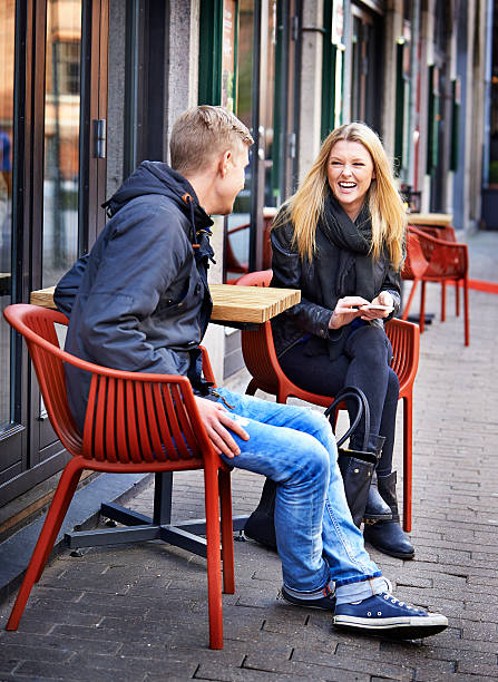 istock Young couple having fun at street cafe 477642459