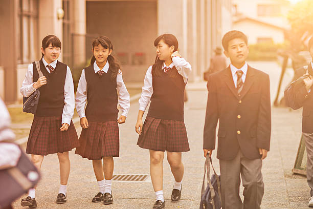istock Japanese students walking outside the school yard 477642658