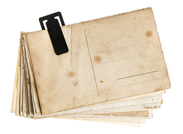 istock pile of old postcards isolated on white background 477643199