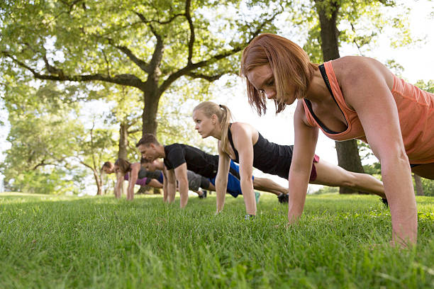 istock Group of People Exercising in the Park 477643830