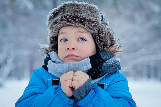 Portrait of little boy in winter time