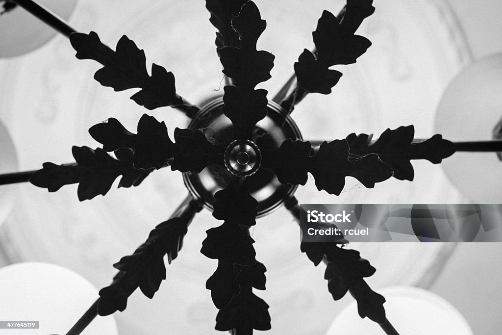 Black and white light chandelier from bellow Black and white light chandelier shot from bellow Abstract Stock Photo