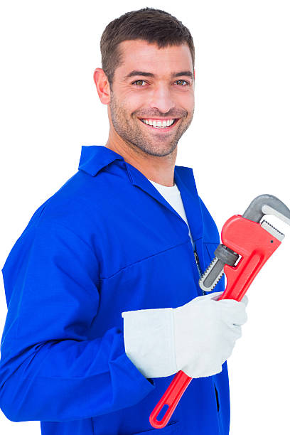 istock Smiling male mechanic holding monkey wrench 477646212