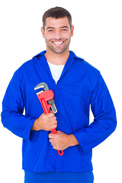 istock Smiling male mechanic holding monkey wrench 477646222