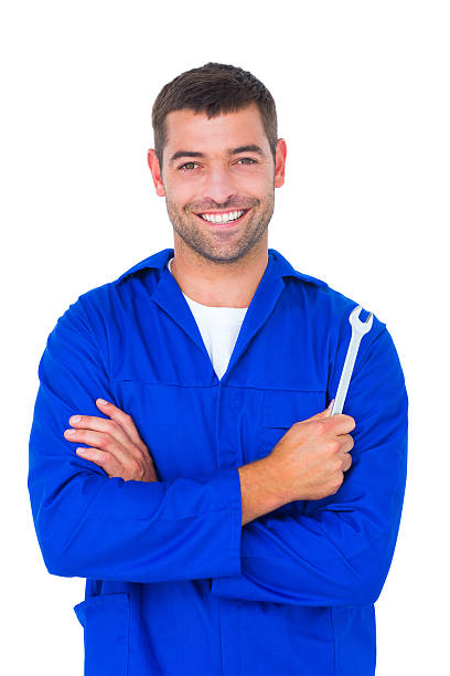 istock Smiling male mechanic holding spanner 477648096