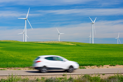Windmills for electric power production and car, Zaragoza province, Aragon, Spain.
