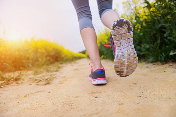 istock Young woman running 477648506