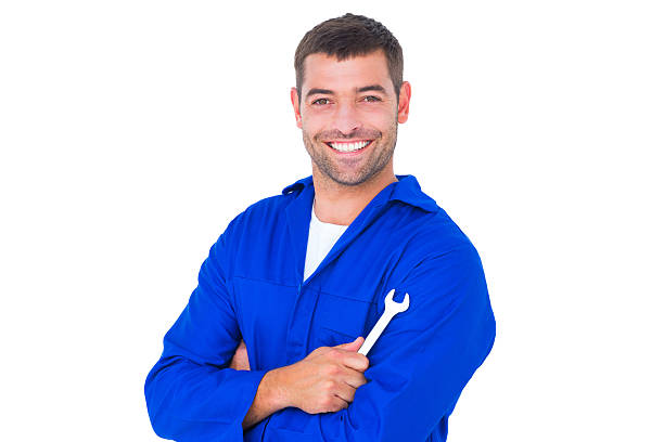 istock Happy mechanic holding spanner on white background 477648526