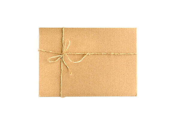 istock Brown paper parcel wrap delivery isolated on white 477649188