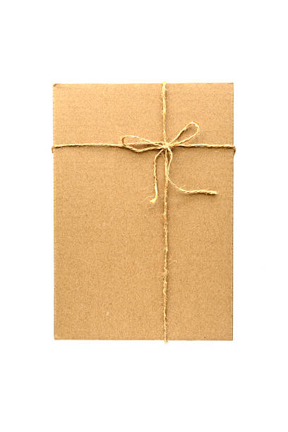 istock Brown paper parcel wrap delivery isolated on white 477649190