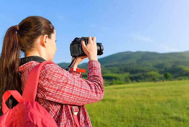 istock Female tourist photographing on camera 477650200