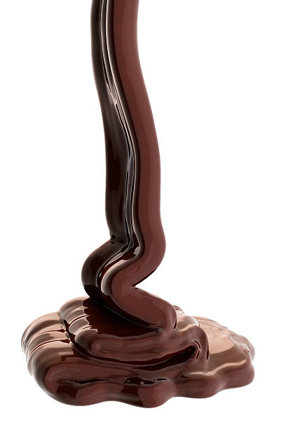 istock Chocolate flow isolated on white background close up 477651392