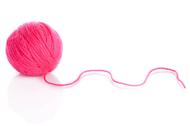 istock Pink Yarn Ball  on white background 477652413