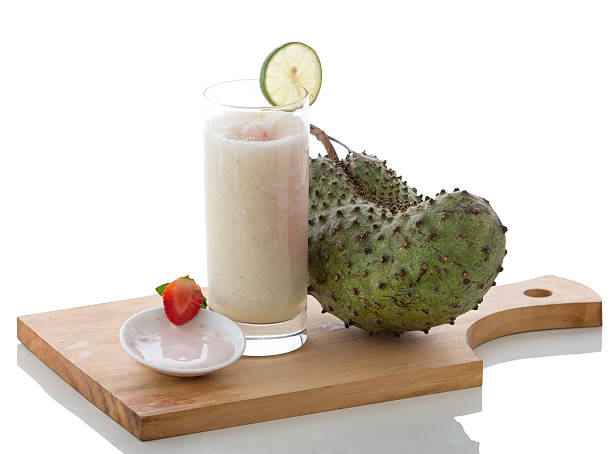Yogurt and Soursop mix smoothies A potrait of a glass yogurt and soursop mix smoothie annona muricata stock pictures, royalty-free photos & images