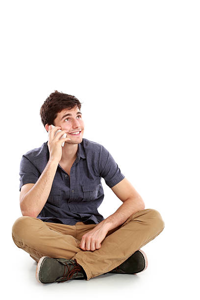 istock casual young man speaking on the phone 477659870