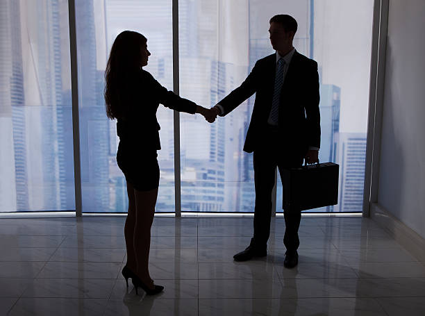 istock Business People Shaking Hands In Office 477660270