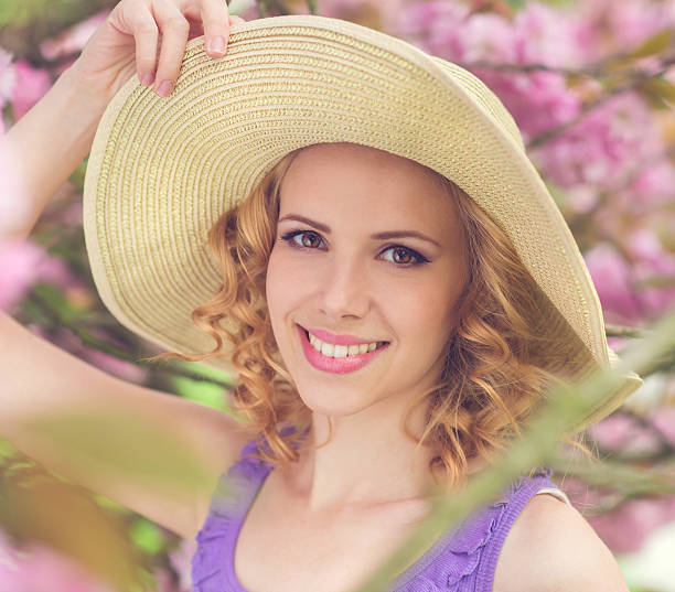 istock Beautiful woman in spring garden 477660388