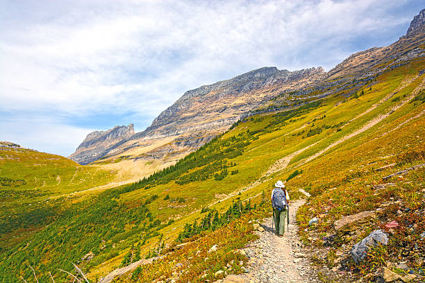 istock Hiker Heading into An Alpine Valley in the Fall 477663564