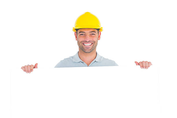 istock Happy handyman holding placard on white background 477666030