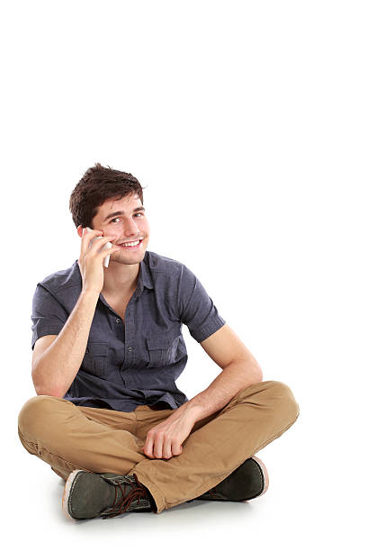 istock casual young man speaking on the phone 477666226